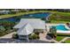 Aerial view of community clubhouse, pool, and lake at 2140 Heron Lake Dr # 204, Punta Gorda, FL 33983