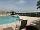 Community pool with lounge chairs and covered seating at 2140 Heron Lake Dr # 204, Punta Gorda, FL 33983