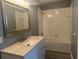 Bathroom with tub, vanity, and updated fixtures at 2140 Heron Lake Dr # 204, Punta Gorda, FL 33983