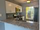 Modern kitchen with granite countertops and stainless steel appliances at 2140 Heron Lake Dr # 204, Punta Gorda, FL 33983