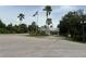 Gated community entrance with flag and signage at 2140 Heron Lake Dr # 204, Punta Gorda, FL 33983