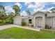 Well-maintained house with a two-car garage and manicured lawn at 5272 Boxer St, North Port, FL 34288