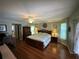 Main bedroom with hardwood floors and large windows at 17034 Toledo Blade Blvd, Port Charlotte, FL 33954