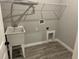Laundry room with utility sink and shelving at 13460 Tolman Ave, Port Charlotte, FL 33953