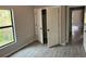 Bedroom with double door closet and tile floors at 13460 Tolman Ave, Port Charlotte, FL 33953