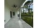 Covered patio with ceiling fan offering outdoor space at 13460 Tolman Ave, Port Charlotte, FL 33953