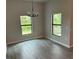 Bright dining room with large windows and tile floor at 13460 Tolman Ave, Port Charlotte, FL 33953