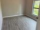 Spacious bedroom with tile floors and large window at 13460 Tolman Ave, Port Charlotte, FL 33953