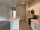 Modern kitchen with stainless steel appliances and island at 13460 Tolman Ave, Port Charlotte, FL 33953