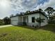 Single-story house with modern design and attached garage at 13460 Tolman Ave, Port Charlotte, FL 33953