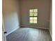 Bedroom with tile floors and large window at 13460 Tolman Ave, Port Charlotte, FL 33953