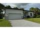 Modern house with gray paver driveway at 13460 Tolman Ave, Port Charlotte, FL 33953