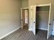 Bedroom with double door closet and tile floors at 13460 Tolman Ave, Port Charlotte, FL 33953