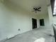 Covered patio with ceiling fan and sliding glass door at 13460 Tolman Ave, Port Charlotte, FL 33953
