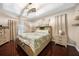 Spacious main bedroom with dark wood floors, tray ceiling, and sliding door access to the outdoors at 17183 Carson Ave, Port Charlotte, FL 33948