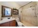 Bathroom with walk-in shower and updated vanity at 14010 Dominion Ct, Tampa, FL 33613