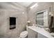 Modern bathroom with gray tile and updated vanity at 14010 Dominion Ct, Tampa, FL 33613