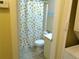 Bright bathroom featuring lemon-themed shower curtain and functional decor at 25275 Rampart Blvd # 2001, Punta Gorda, FL 33983