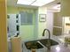 Well-lit kitchen features white appliances, granite counters, and modern finishes at 25275 Rampart Blvd # 2001, Punta Gorda, FL 33983
