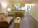 Open floor plan of living room and kitchen, seamlessly connected for modern living at 25275 Rampart Blvd # 2001, Punta Gorda, FL 33983