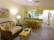 Cozy living room flows into a kitchen with granite countertops, and open floor plan at 25275 Rampart Blvd # 2001, Punta Gorda, FL 33983