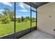 Relaxing screened porch overlooking a lush green backyard at 25275 Rampart Blvd # 1801, Punta Gorda, FL 33983