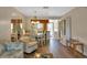 Dining area with wood-look floors and view into kitchen at 25275 Rampart Blvd # 1801, Punta Gorda, FL 33983