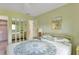 Main bedroom with mirrored closet doors and a ceiling fan at 25275 Rampart Blvd # 1801, Punta Gorda, FL 33983