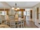 Charming dining room with a round table and white chairs at 25275 Rampart Blvd # 1801, Punta Gorda, FL 33983