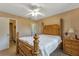 Main bedroom with a wooden bed frame and carpet floors at 25275 Rampart Blvd # 2001, Punta Gorda, FL 33983