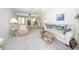 Spacious living room with sofa and wicker coffee table at 3251 White Ibis Ct # A4, Punta Gorda, FL 33950