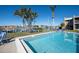 Refreshing community pool with seating and waterfront access at 3251 White Ibis Ct # A4, Punta Gorda, FL 33950