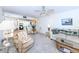 Living room with sofa, recliner, and view of kitchen at 3251 White Ibis Ct # A4, Punta Gorda, FL 33950
