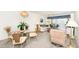 Living room features comfy seating and access to a balcony at 3251 White Ibis Ct # A4, Punta Gorda, FL 33950