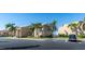 Tan condo building with palm trees and parking at 3251 White Ibis Ct # A4, Punta Gorda, FL 33950