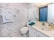 Clean bathroom with seashell-themed wallpaper and shower/tub combo at 3251 White Ibis Ct # A4, Punta Gorda, FL 33950