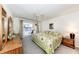 Spacious main bedroom with king-size bed and sliding door access to balcony at 3251 White Ibis Ct # A4, Punta Gorda, FL 33950