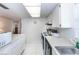 Modern kitchen with stainless steel appliances and white cabinets at 3251 White Ibis Ct # A4, Punta Gorda, FL 33950