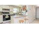 Efficient kitchen with white cabinets and appliances at 3251 White Ibis Ct # A4, Punta Gorda, FL 33950