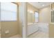 Bathroom features a double vanity and a bathtub at 1519 Atares Dr # 112, Punta Gorda, FL 33950