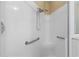Walk-in shower with grab bars and tiled walls at 1519 Atares Dr # 112, Punta Gorda, FL 33950