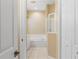 Clean bathroom with a bathtub and mirrored medicine cabinet at 1519 Atares Dr # 112, Punta Gorda, FL 33950