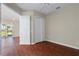 Spacious bedroom with wood floors and double doors to closet at 1519 Atares Dr # 112, Punta Gorda, FL 33950