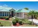 Attractive home exterior with a metal roof and lush landscaping at 1519 Atares Dr # 112, Punta Gorda, FL 33950