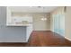 Bright kitchen features white cabinetry and a breakfast bar at 1519 Atares Dr # 112, Punta Gorda, FL 33950