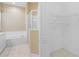 Bathroom with shower, tub, and walk-in closet at 1519 Atares Dr # 112, Punta Gorda, FL 33950