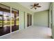 Spacious screened porch with golf course view and ceiling fan at 1519 Atares Dr # 112, Punta Gorda, FL 33950