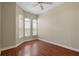 Spacious bedroom with hardwood floors and arched windows at 1519 Atares Dr # 112, Punta Gorda, FL 33950