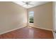 Bright bedroom with laminate wood flooring and ceiling fan at 1519 Atares Dr # 112, Punta Gorda, FL 33950