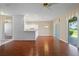 Living room with hardwood floors and sliding doors to backyard at 1519 Atares Dr # 112, Punta Gorda, FL 33950